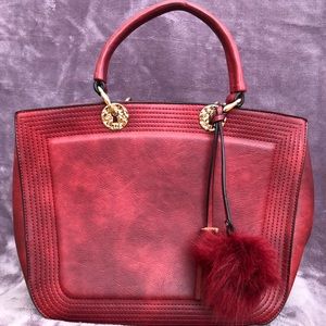 Red/smokey purse with pompon and tassel detail, only used a few times.